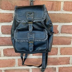 Black backpack purse with fleece trim. designer: saddle River